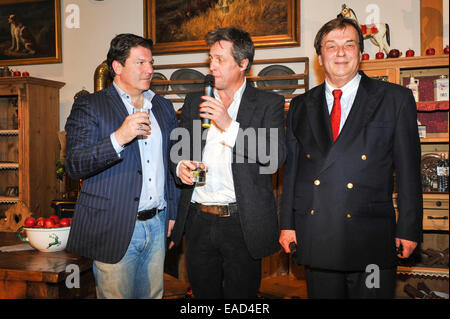 Henndorf near Salzburg, Austria. 11th November, 2014. British actors Hugh Grant and Francis Fulton Smith with Michael Aufhauser, owner of the estate, on November 11, 2014 at the opening of the Christmas Market at Aiderbichl Estate in Henndorf near Salzburg, Austria. Credit:  dpa picture alliance/Alamy Live News Stock Photo