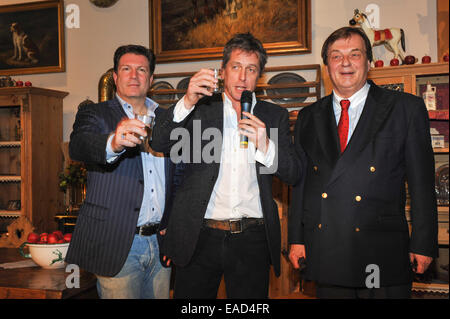 Henndorf near Salzburg, Austria. 11th November, 2014. British actors Hugh Grant and Francis Fulton Smith with Michael Aufhauser, owner of the estate, on November 11, 2014 at the opening of the Christmas Market at Aiderbichl Estate in Henndorf near Salzburg, Austria. Credit:  dpa picture alliance/Alamy Live News Stock Photo