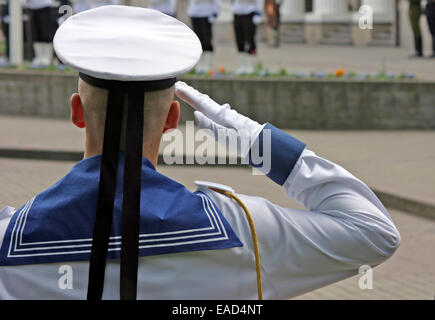 Navy soldier salutes at the Lithuanian national flag ceremony in Vilnius Stock Photo
