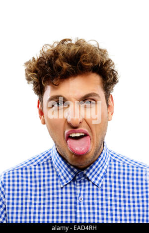 Portrait of a young man showing his tongue Stock Photo