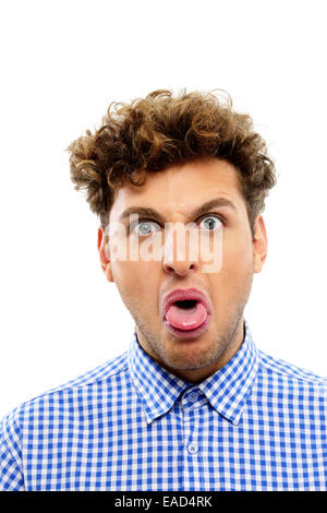 Portrait of a young man showing his tongue Stock Photo