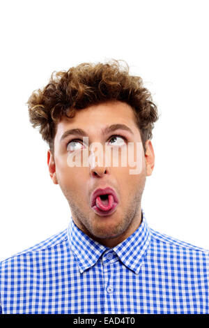 Portrait of a young man showing his tongue Stock Photo