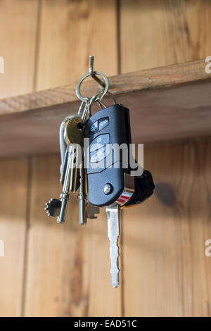 Car keys hanging on a hook in a house. Stock Photo