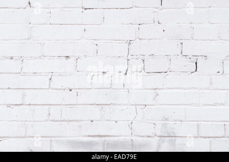 white painted brick cracked wall background Stock Photo