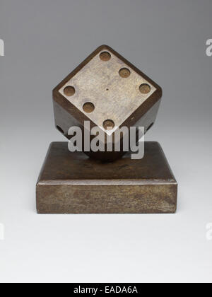 Art Deco Edgar Brandt wrought iron paperweight in the form of a dice standing on one corner, made circa 1930. Stock Photo