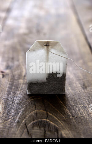 Tea Bag on old wooden table, close up Stock Photo