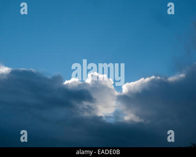 Carmarthenshire,Wales, UK. Wed 12th Nov 2014. November autumn weather today is a mixture of rainy, sunny periods. Blue sky and cumulous clouds with sun emerge from another wave of dark clouds and rain  Kathy deWitt/AlamyLiveNews Stock Photo