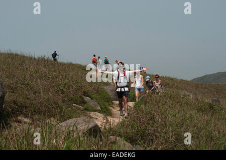Hikers walking down the steep trails of Sunset Peak, Tai Tung Shan, located on Lantau Island Hong Kong China Stock Photo