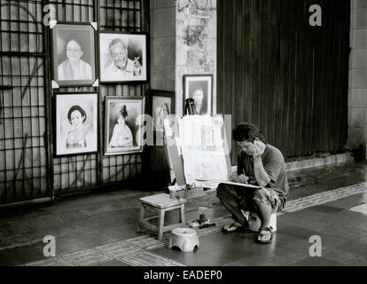 Solitude of the street artist on the streets of the city of Jakarta in Java in Indonesia in Southeast Asia Far East. Reportage Photojournalism Travel Stock Photo