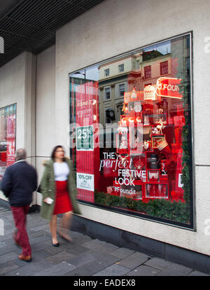 Liverpool, Merseyside, UK 12th November, 2014.  Debenhams Launches 25% off everything Christmas Sales Campaign. Situated in Lord Street Liverpool's business district, the retail store is among the first in the city to decorate its windows with a Xmas Theme which is..... The Perfect Festive Winter Wardrobe.  Found it! Liverpool's business district, Stock Photo