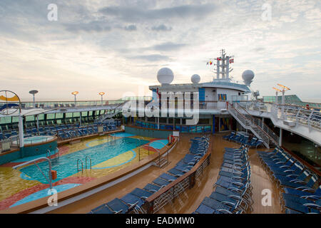 Swimming pool on the deck of Royal Caribbean's Brilliance of the Seas cruise ship. Stock Photo