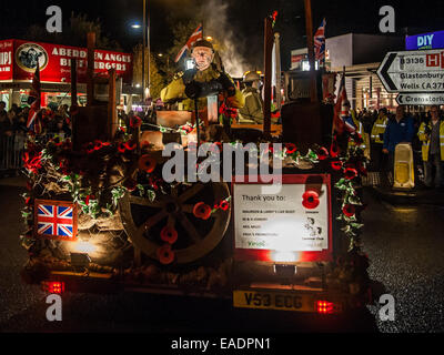 Shepton Mallet, UK. 12th November, 2014. Illuminated floats or 'carts' lit up the streets during the Shepton Mallet Carnival 2014. The carnival is to commemorate the attempted blowing up of the Houses of Parliament by Guy Fawkes. Credit:  Pete Maclaine/Alamy Live News Stock Photo