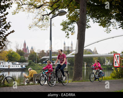 Man riding a bike with his daughters at the Charles Eyck Park in Maastricht, The Netherlands, Europe Stock Photo