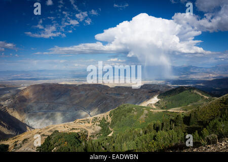 The Bingham Canyon Copper mine outside of Salt Lake City, Utah, with a squall in the distance. Stock Photo