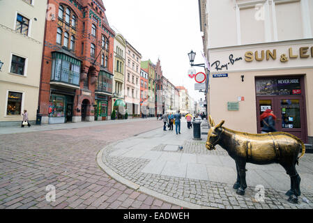 TORUN, POLAND - OCTOBER 23, 2014: The donkey sculpture is a recreation of an old wooden medieval donkey that once stood in the s Stock Photo