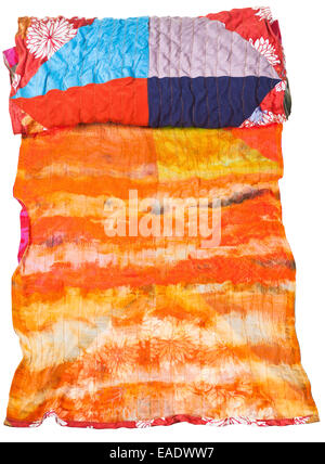 rolled silk batik and patchwork scarf isolated on white background Stock Photo