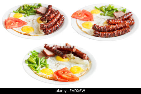 three plates with fried eggs, sausages, tomato, beans isolated on white background Stock Photo