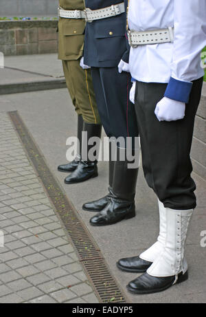 Three soldiers stand guard at Lithuanian national flag ceremony in capital Vilnius Stock Photo
