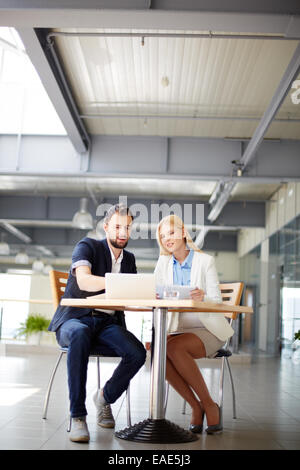 Two colleagues discussing electronic data Stock Photo