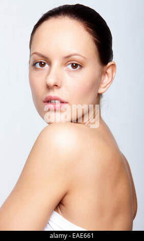 Gorgeous woman with natural makeup posing for camera in isolation Stock Photo