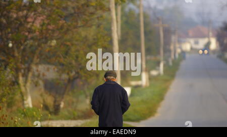 Man walking alone with his thoughts. Stock Photo
