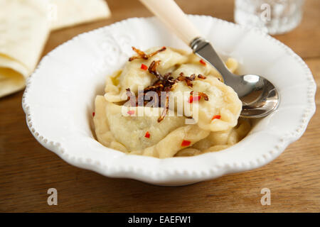 Homemade potato dumplings with onion Stock Photo