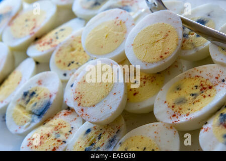 sliced hard boiled eggs with spices for breakfast Stock Photo