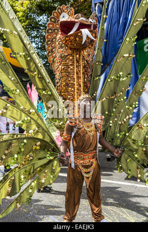 Dancers at the Notting Hill Carnival in London wear exotic and colourful costumes Stock Photo