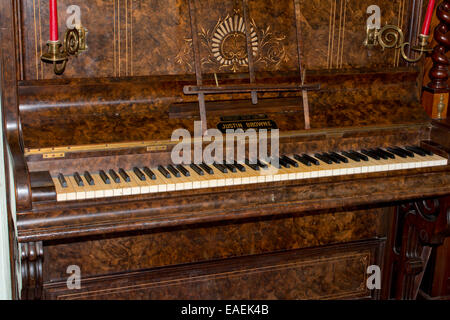 Late nineteenth century Justin Browne upright cast-iron frame grand piano Stock Photo