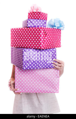 Beautiful woman's hands holding a colorful gift boxes with ribbon. Studio portrait isolated over white background Stock Photo