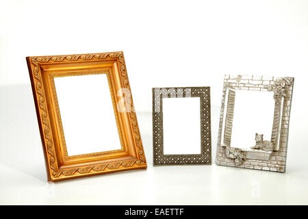 three isolated ornate empty picture frames on white Stock Photo