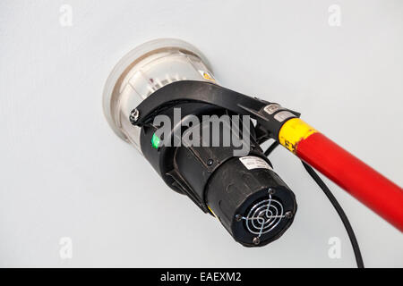 Fire alarm inspection using a smoke tube detector, UK Stock Photo
