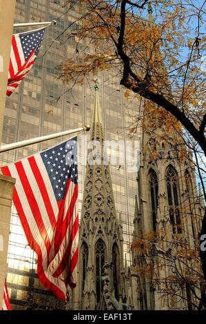 NYC:  American Flags on Fifth Avenue, the Olympic Tower, and the twin spires of St. Patrick's Cathedral at East 51st Street Stock Photo
