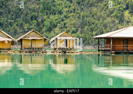 Small bungalow made of bamboo floating. Surrounded by mountains and water in Ratchaprapha Dam, Khao Sok National Park, Surat Tha Stock Photo