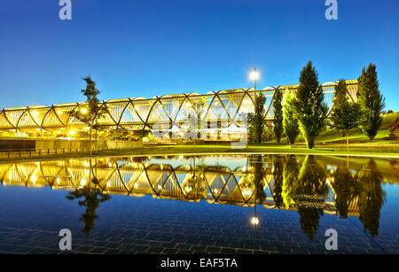 The sun sets over the Arganzuela bridge, designed by architect Dominique Perrault. Madrid Rio Park. Madrid. Spain Stock Photo