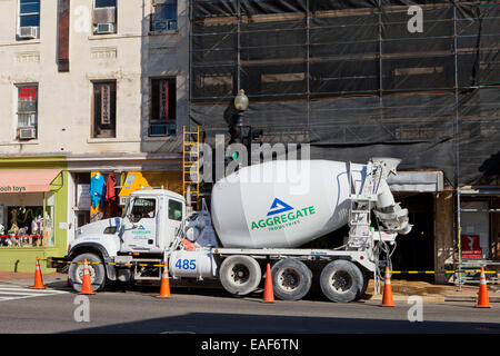 Rear-discharge concrete transport truck on construction site - USA Stock Photo