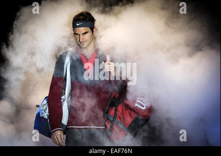 London, Britain. 13th Nov, 2014. Roger Federer of Switzerland walks onto the court before the ATP World Tour Finals round robin match against Andy Murray of Britain in London, Britain, on Nov. 13, 2014. Federer defeated Murray 2-0. Credit:  Tang Shi/Xinhua/Alamy Live News Stock Photo