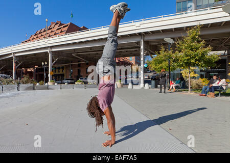 Man doing handstand - Georgetown, Washington, DC USA Stock Photo
