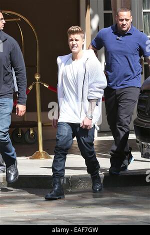 Justin Bieber in white net jumper, jeans and black combat boots leaves ...