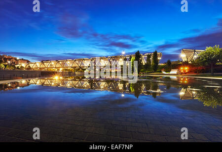 The sun sets over the Arganzuela bridge, designed by architect Dominique Perrault. Madrid Rio Park. Madrid. Spain Stock Photo