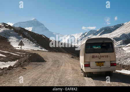Driving into Mt Everest (Qomolangma) Base Camp, Tibet, China, before the road was rebuilt in 2015. Mt Everest (8848m) looms up at left. Stock Photo