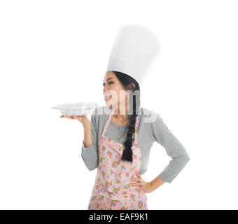 asian female chef holding a plate in casual Stock Photo