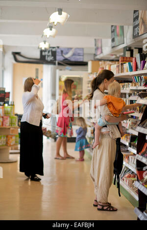 Shoppers at the Better Food Company organic supermaket in St. Werburgh's, Bristol 2014 Stock Photo