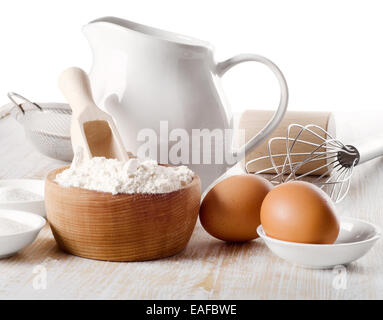 baking ingredients on a wooden table isolated on white. Selective focus Stock Photo