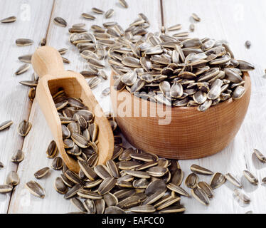 Sunflower seeds in  wooden bowl . Selective focus Stock Photo