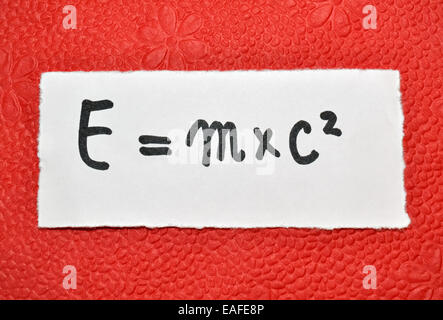 Famous physical formula on a vibrant red background Stock Photo