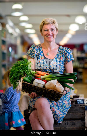 The Better Food Company organic supermaket in St. Werburgh's, Bristol UK - Lucy Gatward, Marketing Manager 2014 Stock Photo