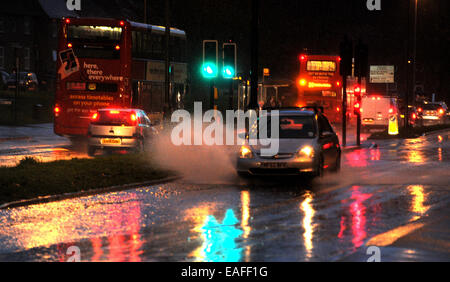 Brighton UK 14th November 2014 - Traffic drives through surface water flooding on the Lewes Road in Brighton early this morning Stock Photo
