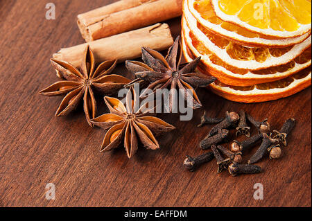 Christmas decoration - anise stars, orange slices, cinnamon and cloves Stock Photo