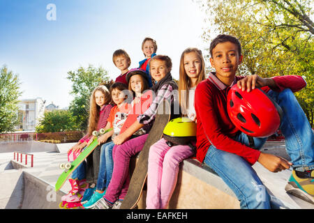 Group of international children with skateboards Stock Photo